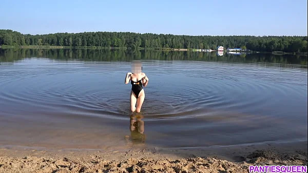 Naked girl goes skinny dipping in public beach