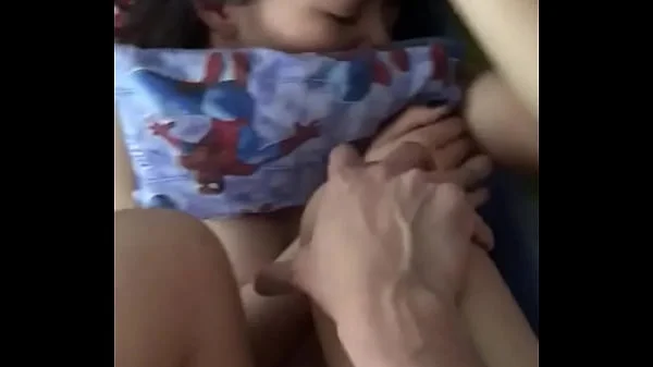 Shy petite Asian bites the pillow