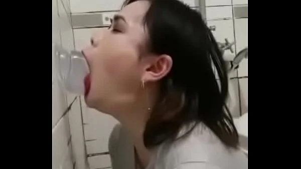 Asian deepthroating a dildo