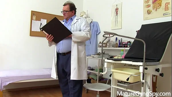 Spycam recording of naked young MILF on her gyno exam
