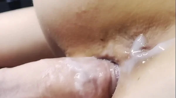 Doggystyle extremely close-up. Creampie